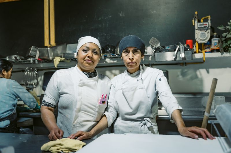 Papa Ginos kitchen team preparing fresh papa gino's dishes with quality ingredients